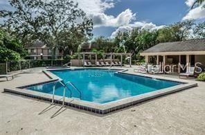 view of swimming pool featuring a patio