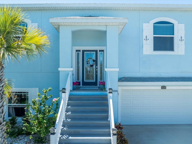 doorway to property featuring a garage