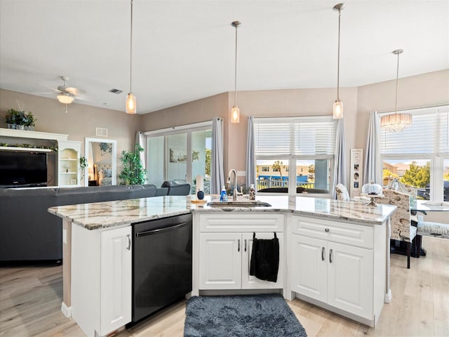 kitchen featuring hanging light fixtures, dishwasher, white cabinets, and a healthy amount of sunlight