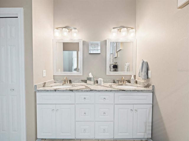 bathroom featuring dual bowl vanity