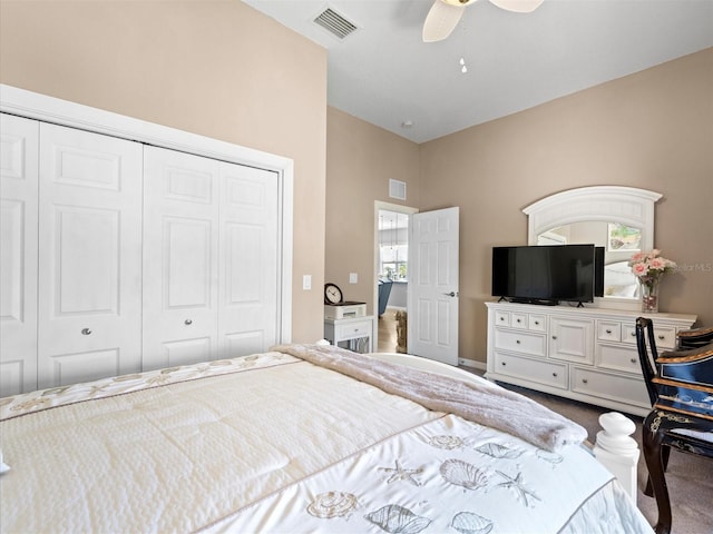 carpeted bedroom featuring a closet and ceiling fan