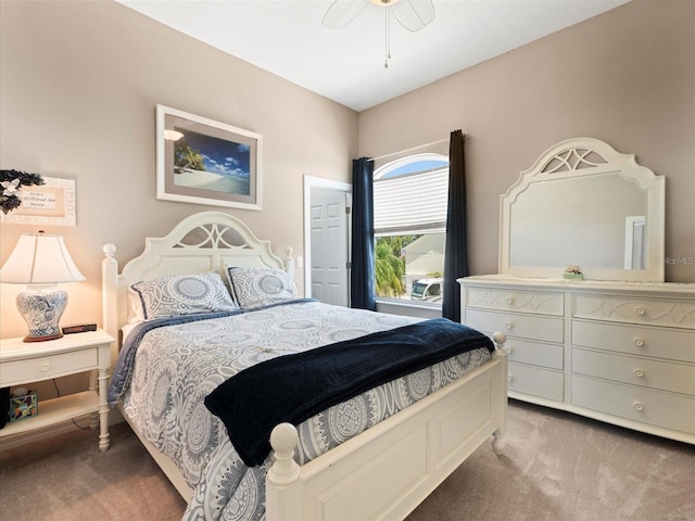 bedroom featuring dark colored carpet and ceiling fan