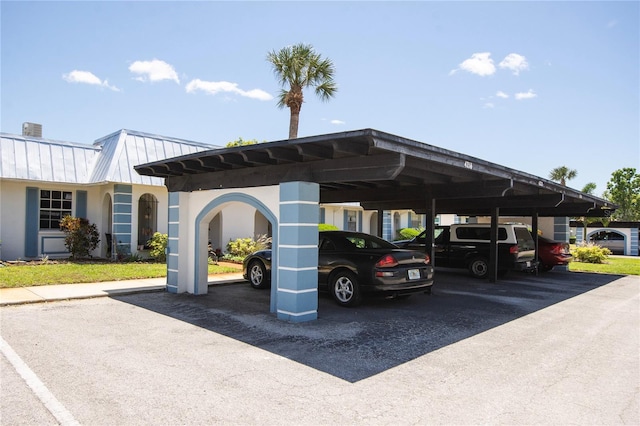 view of vehicle parking with a carport