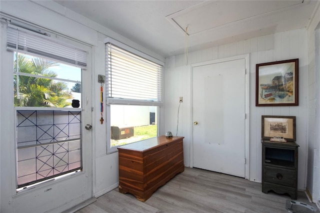 doorway to outside with light wood-type flooring