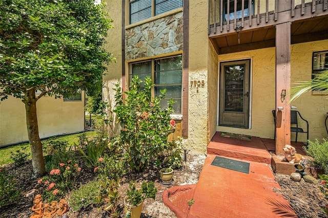 doorway to property featuring a balcony