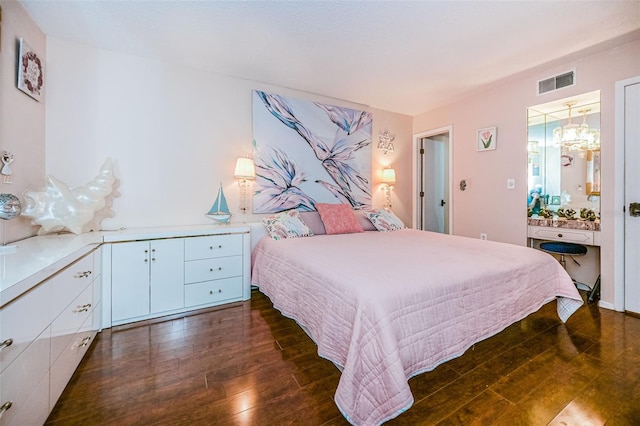 bedroom with dark hardwood / wood-style floors