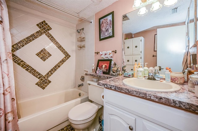 full bathroom featuring a textured ceiling, oversized vanity, shower / bath combination with curtain, tile floors, and toilet