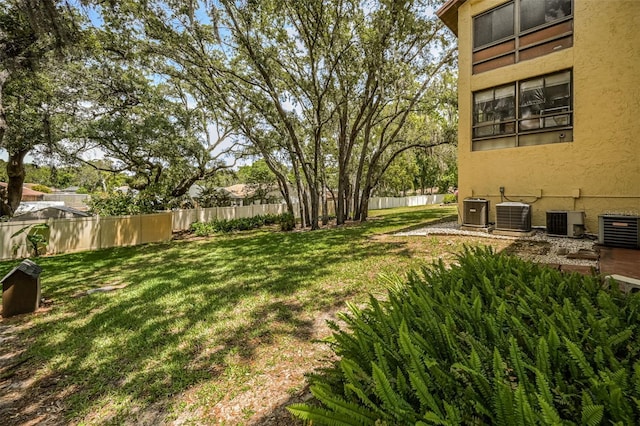 view of yard with central AC