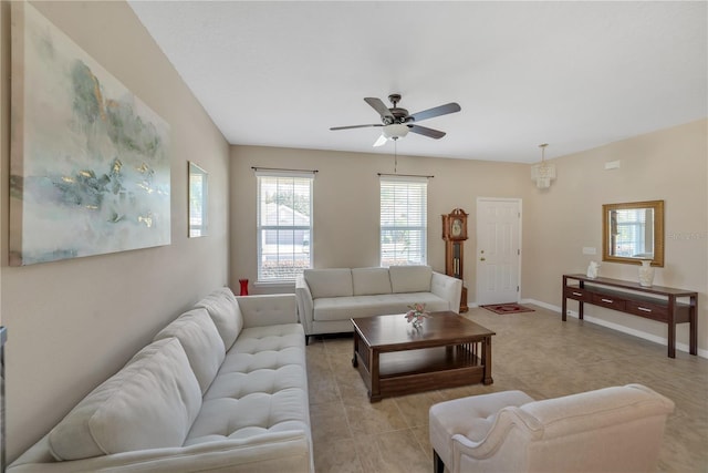 living room with ceiling fan and light tile flooring