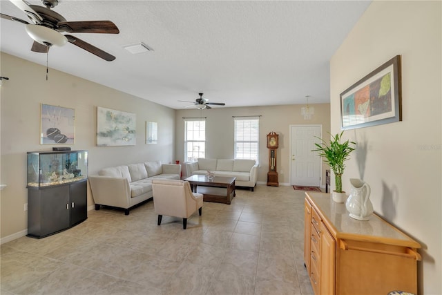 living room featuring ceiling fan and light tile floors