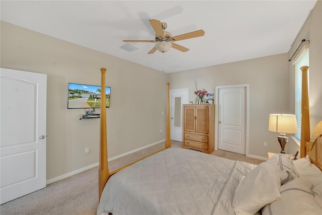 bedroom featuring light carpet and ceiling fan