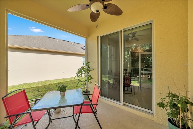 sunroom / solarium featuring ceiling fan