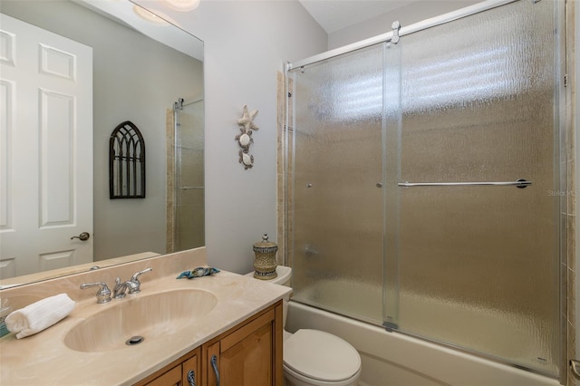 full bathroom with shower / bath combination with glass door, vanity, and toilet