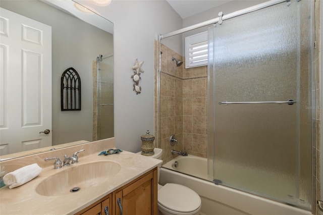 full bathroom with shower / bath combination with glass door, vanity, and toilet