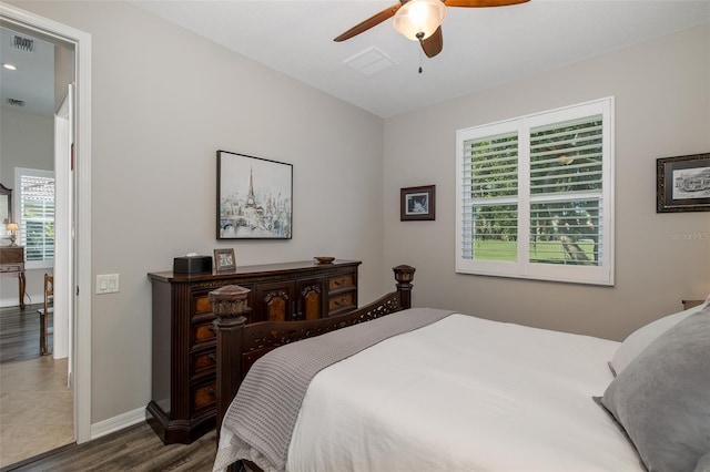 bedroom featuring ceiling fan and dark wood-type flooring