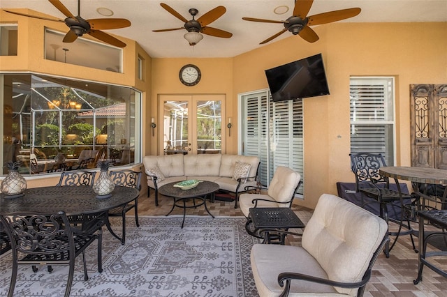 interior space featuring ceiling fan and french doors