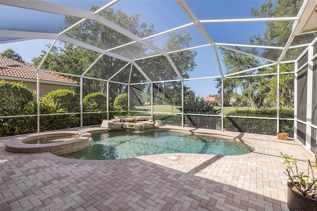 view of swimming pool featuring an in ground hot tub, pool water feature, glass enclosure, and a patio area