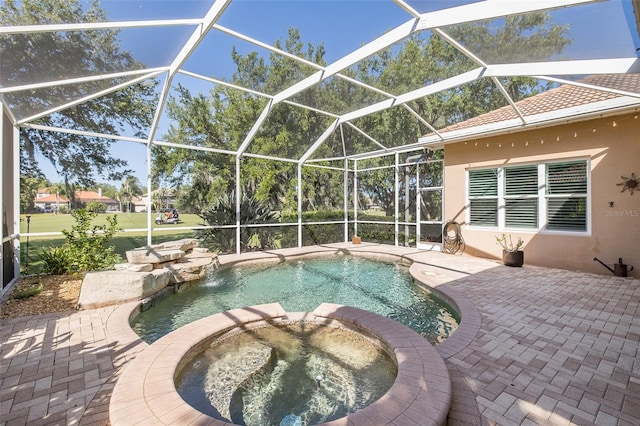 view of swimming pool featuring an in ground hot tub, pool water feature, a patio, and glass enclosure