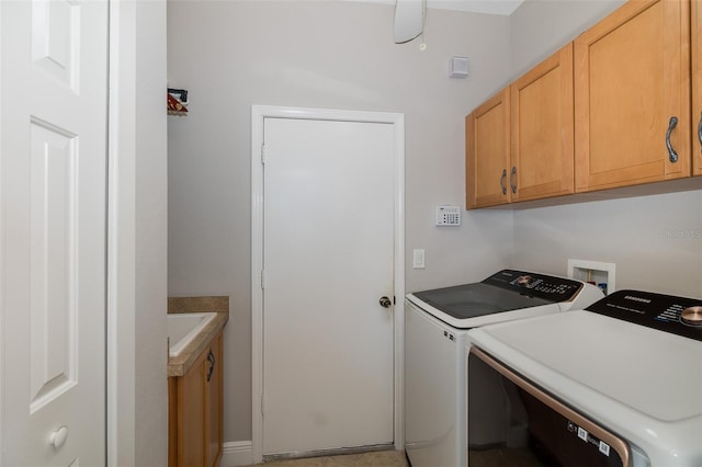 washroom with cabinets and independent washer and dryer