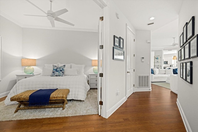 bedroom featuring ceiling fan, wood-type flooring, and ornamental molding