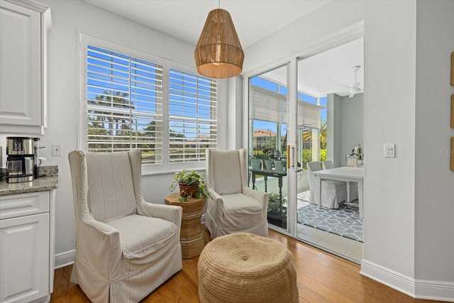 sitting room with hardwood / wood-style flooring