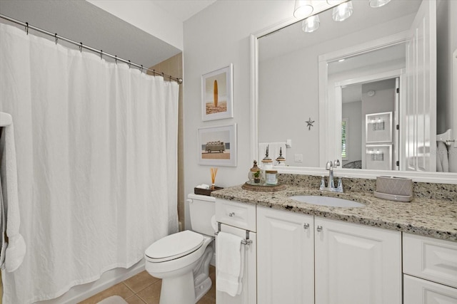 full bathroom featuring toilet, vanity, tile patterned floors, and shower / bathtub combination with curtain