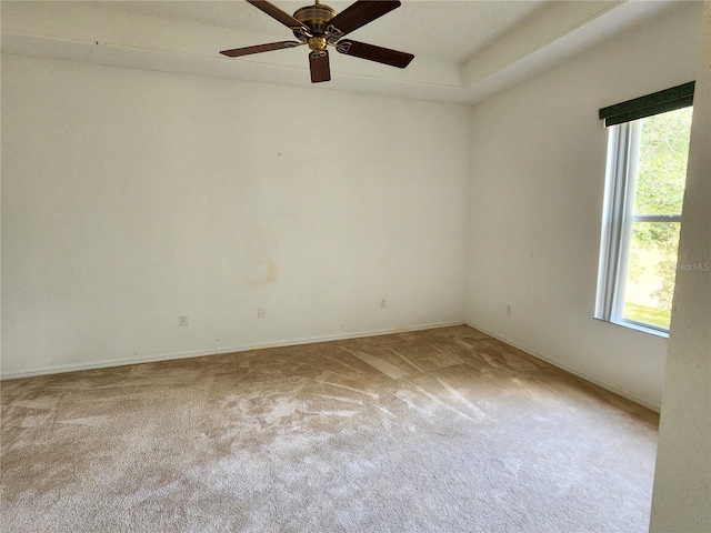 spare room with carpet floors and ceiling fan