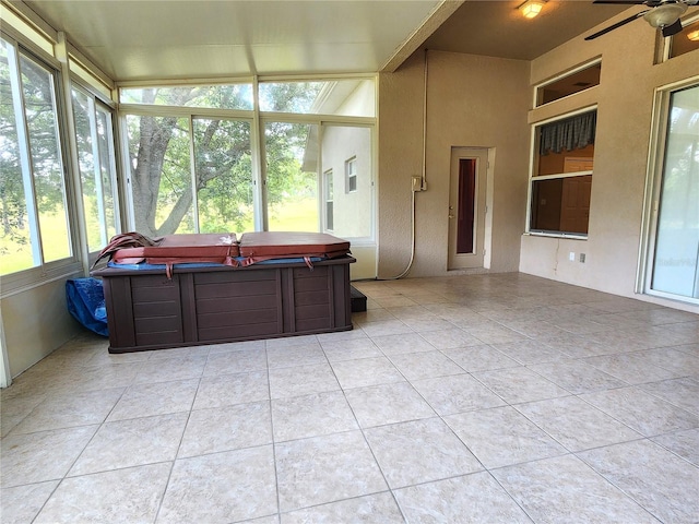 sunroom / solarium with ceiling fan and plenty of natural light