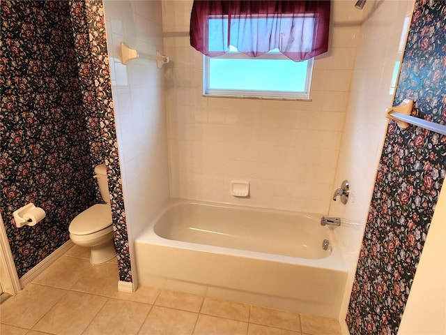 bathroom with tile floors, shower / tub combo, and toilet