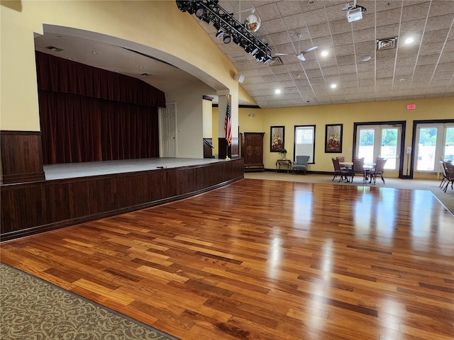 interior space featuring french doors, a high ceiling, and hardwood / wood-style floors