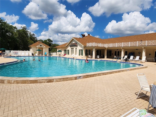 view of swimming pool with a patio area