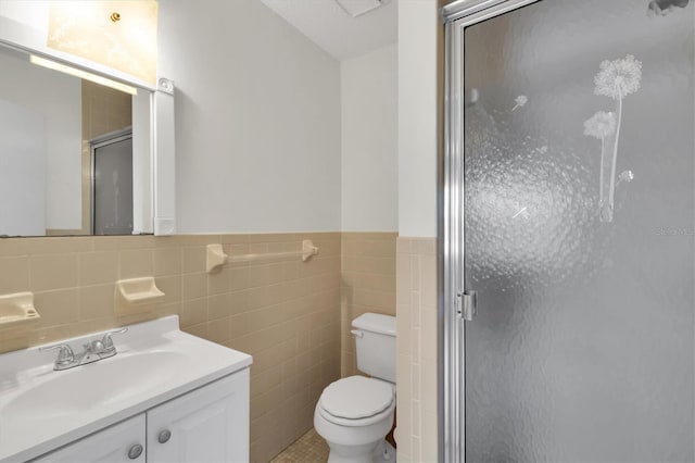 bathroom with oversized vanity, tile walls, toilet, and tile floors