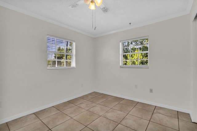 empty room featuring plenty of natural light, ceiling fan, and crown molding