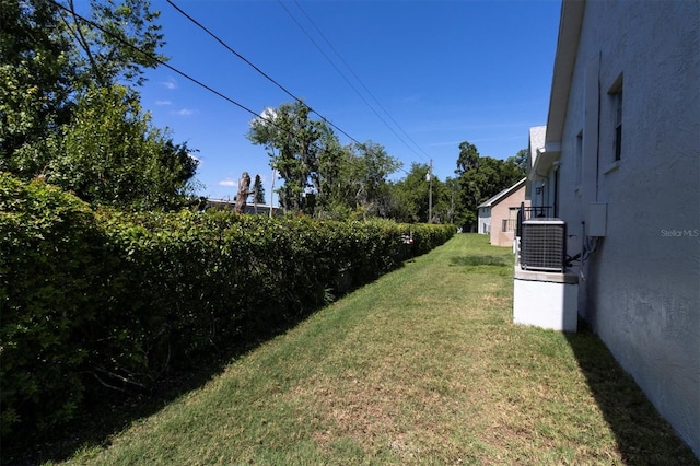 view of yard featuring central air condition unit