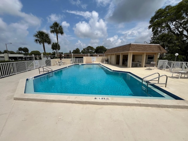 view of swimming pool with a patio area