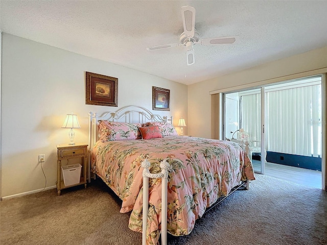 carpeted bedroom with ceiling fan and a textured ceiling