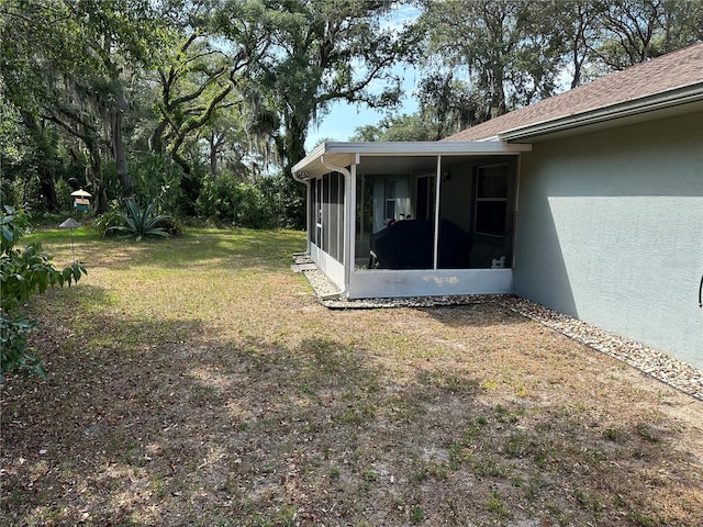 view of yard featuring a sunroom