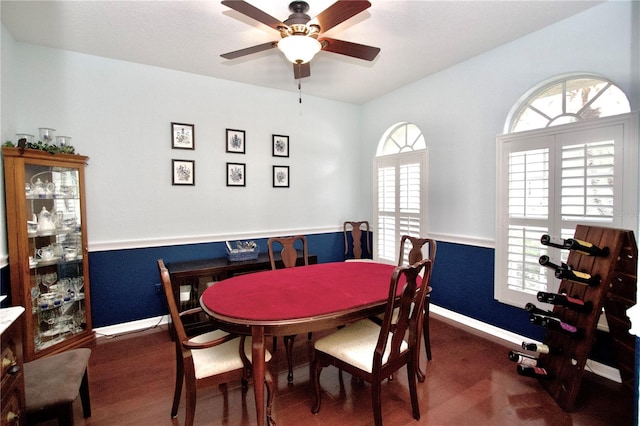 dining area featuring dark hardwood / wood-style flooring and ceiling fan