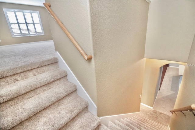 stairway with carpet floors