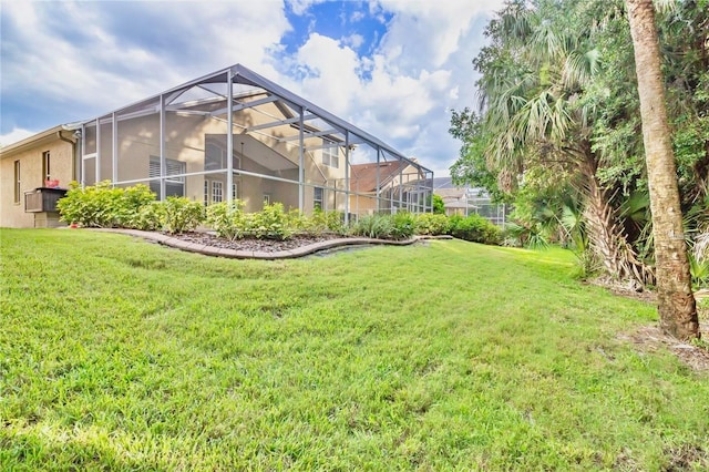 view of yard with a lanai