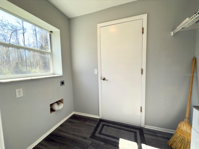 washroom featuring hookup for an electric dryer and dark hardwood / wood-style flooring