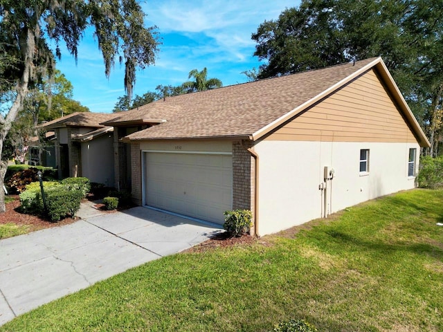 ranch-style home featuring a garage and a front lawn