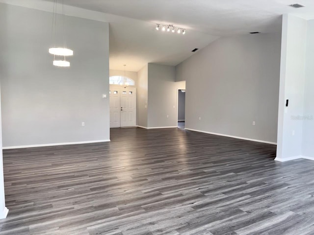 unfurnished living room featuring dark hardwood / wood-style flooring and high vaulted ceiling