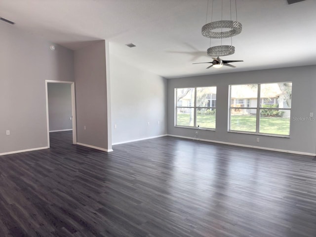 empty room featuring ceiling fan and dark hardwood / wood-style floors