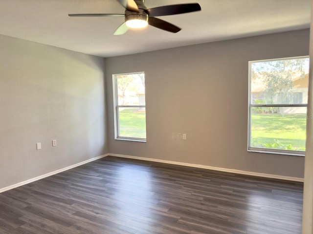 unfurnished room featuring dark hardwood / wood-style floors and ceiling fan