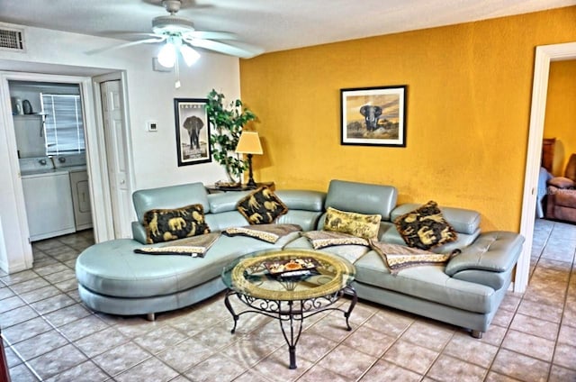 tiled living room with ceiling fan