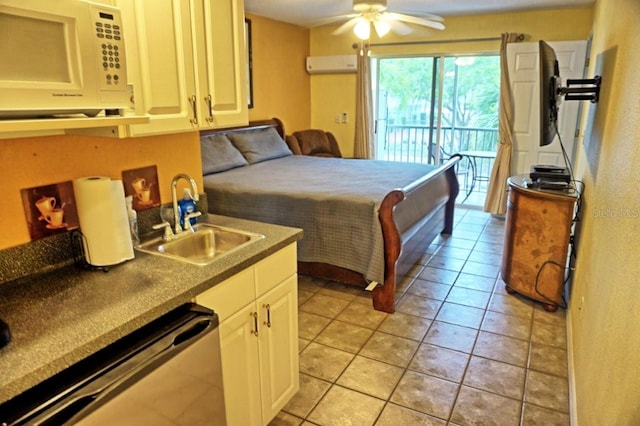 tiled bedroom with a wall mounted AC, sink, ceiling fan, and access to outside