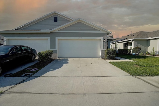 ranch-style house featuring a garage