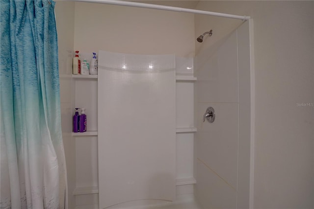 bathroom featuring a shower with curtain