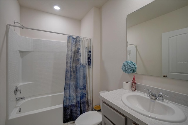 full bathroom featuring shower / bath combo, toilet, and vanity